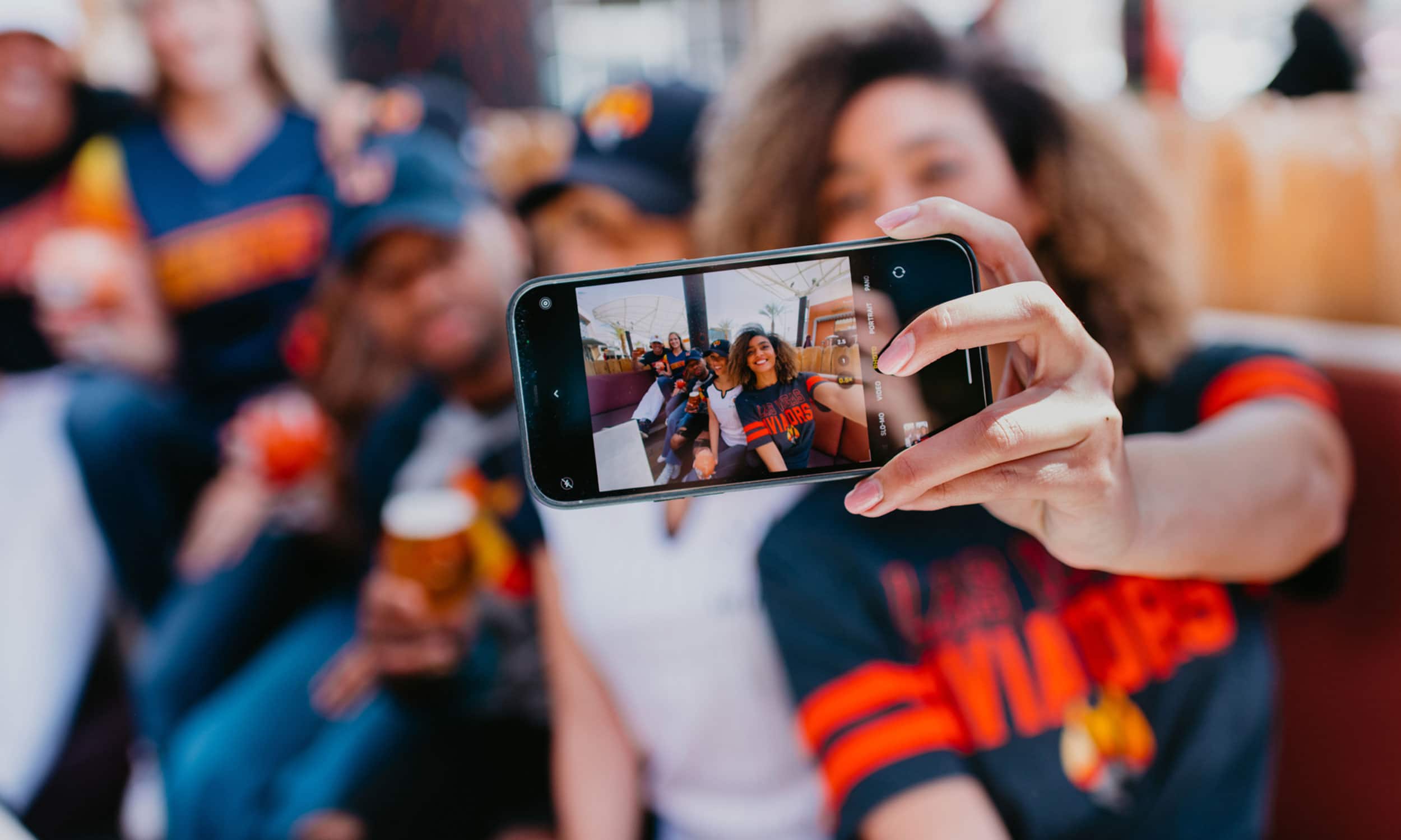 Fan taking selfie at baseball game