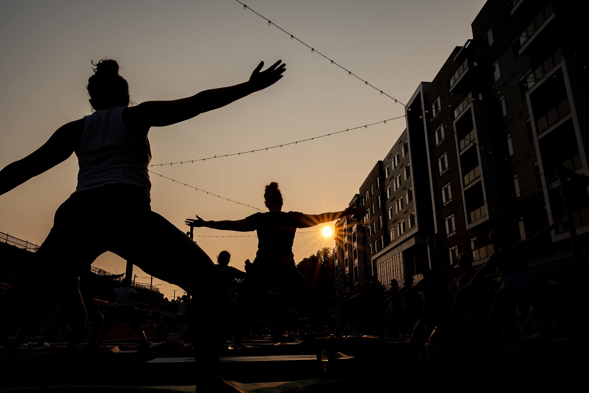 Yoga in the street at dusk