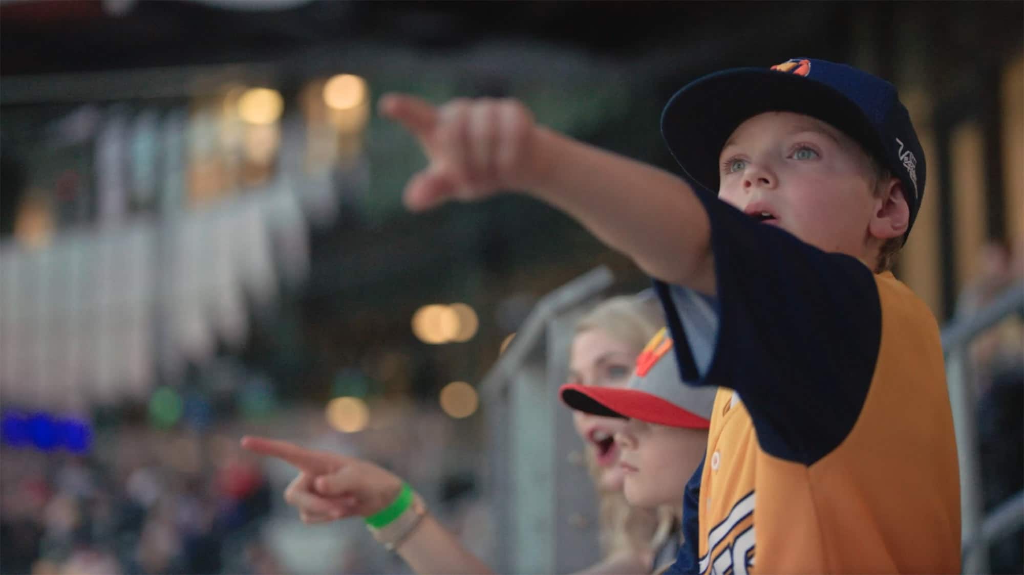 Boy pointing while at the game