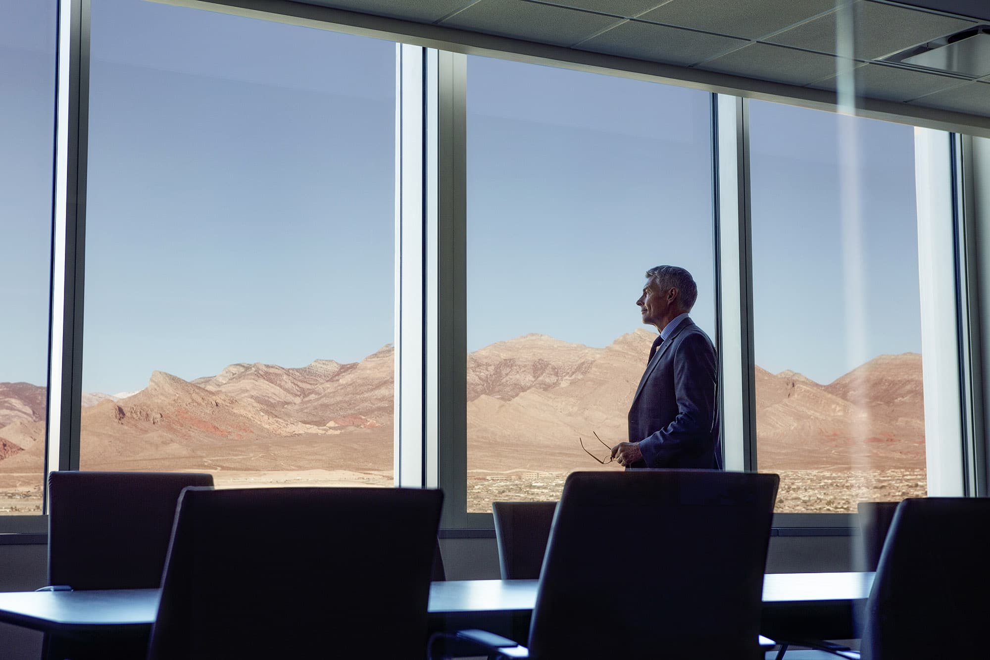 Man looking outside Summerlin office