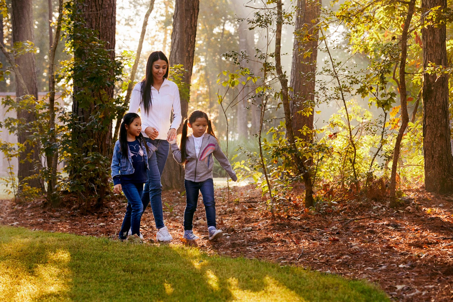 Mother and children walking in nature