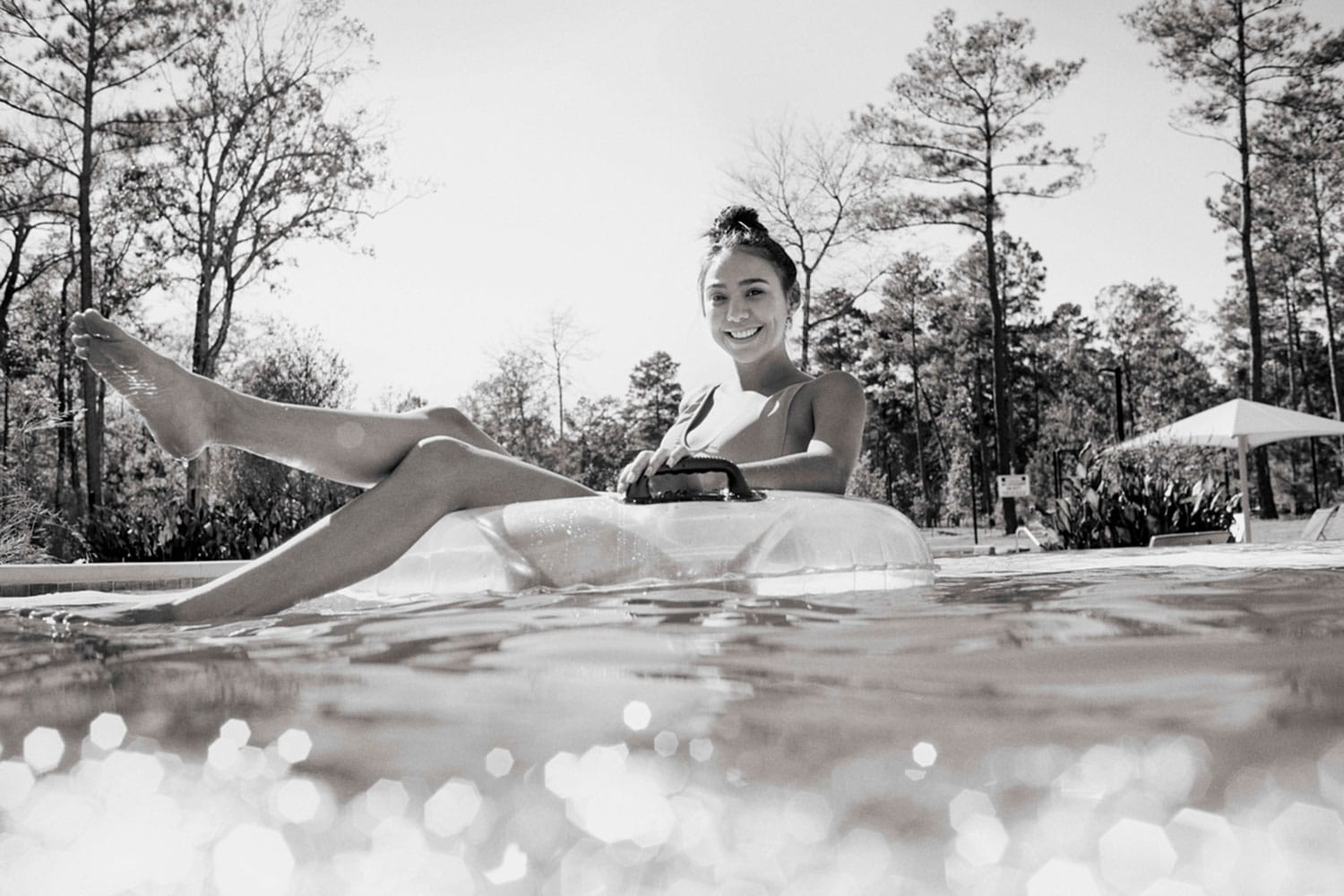 Girl on inner tube in pool